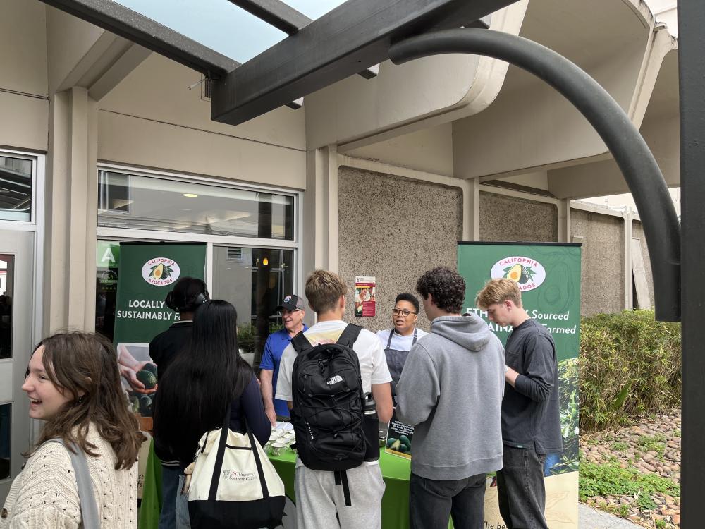 Trivia questions about California avocados helped students learn more about sustainably grown California avocados; Chef Aneesha describing the California Avocado Chocolate Overnight Oats to a student