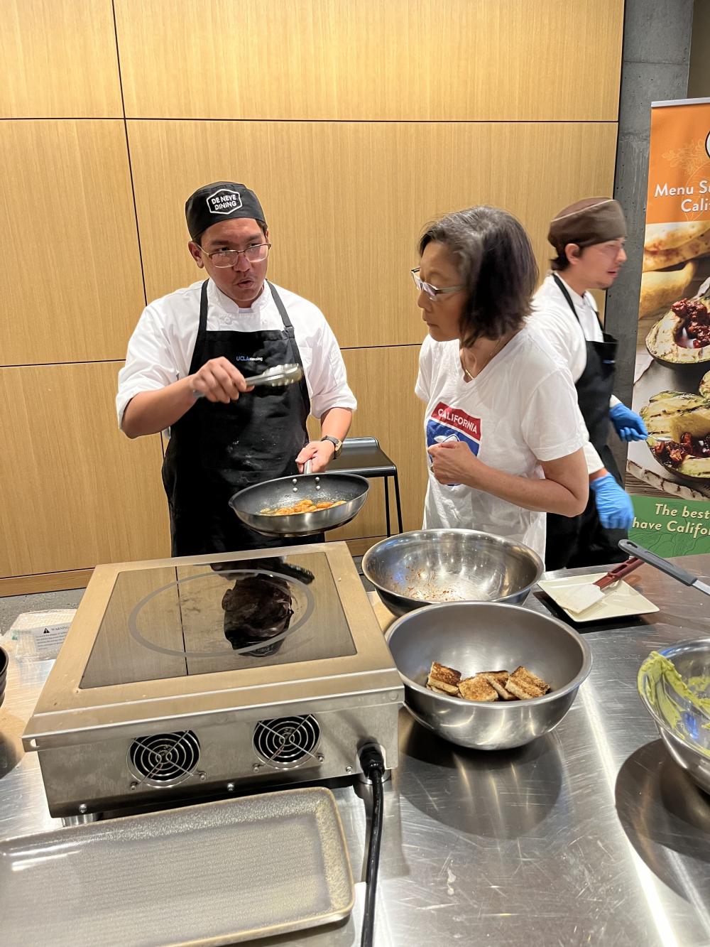 A UCLA culinary team member described his unique California avocado dish to foodservice team member Kim Kurata.