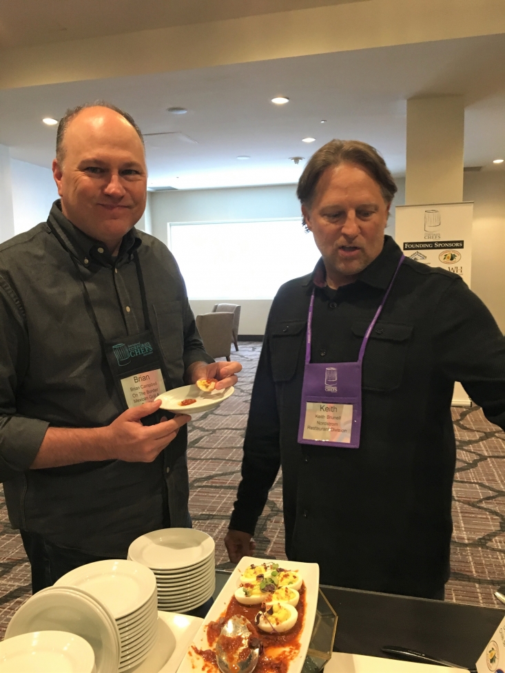 Brian Campbell, On The Border, and Keith Brunell, Nordstrom Restaurant Group, enjoying a break with California Avocado Deviled Eggs with Chile de Arbol Salsa.