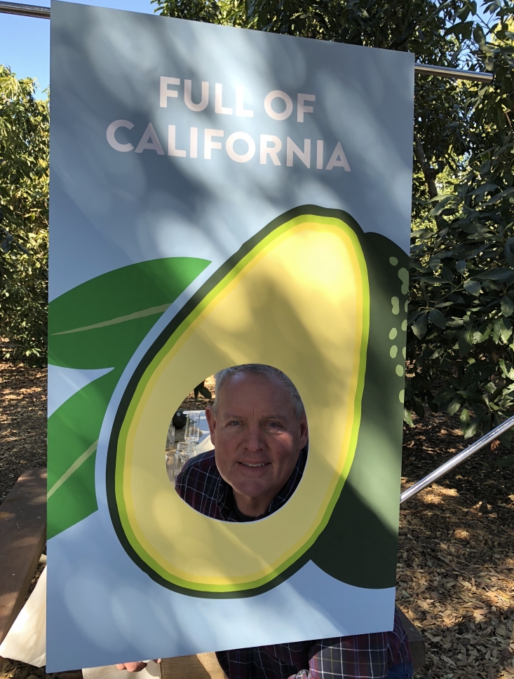 California avocado grower Randy Axell tries out one of CAC's photo booth props.